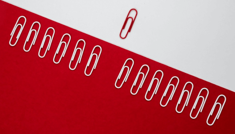 white and red paper clips representing Amazon email attachments