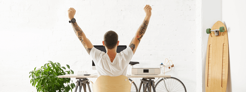 Man celebrating success after hiring Amazon freelancer