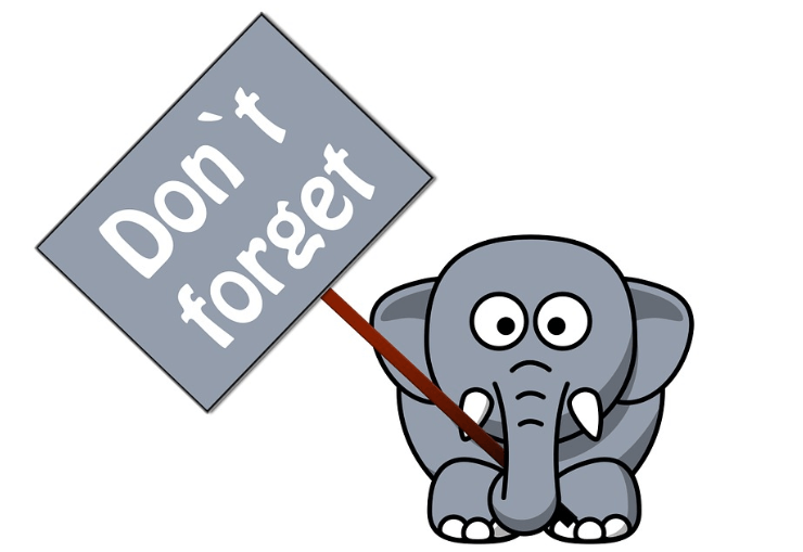 Elephant holding a sign saying don't forget