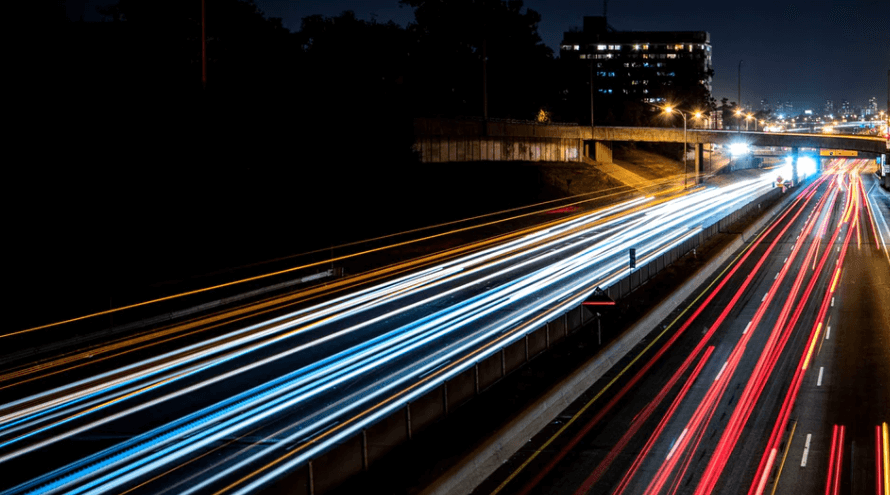 time-lapse photography of traffic driving at night