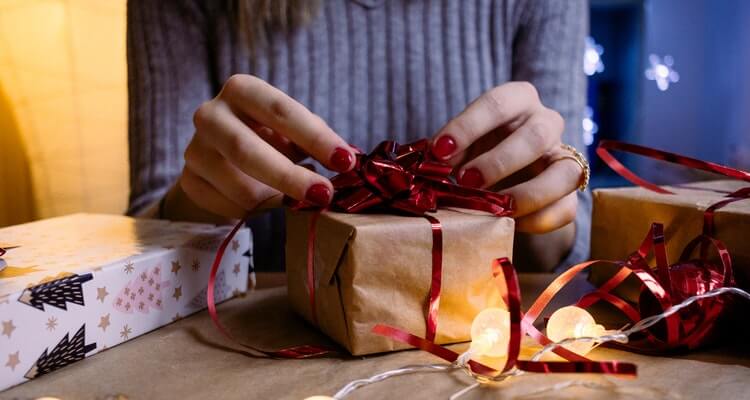 Amazon holiday deals: image of someone wrapping a present