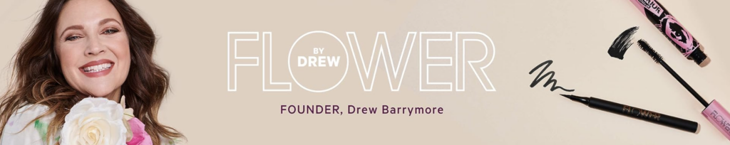 A banner image showing Drew Barrymore holding a bouquet of large pink and white flowers on the left side. On the right side of the image is an eyeliner marker and an open tube of mascara. The center of the image reads "Flower by Drew. Founder, Drew Barrymore."