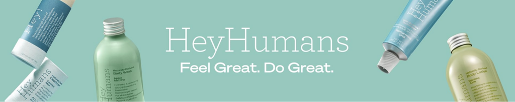 A teal colored banner image with several bottles of Hey Humans skincare products. The image has white text that reads "Hey Humans. Feel Great. Do Great."